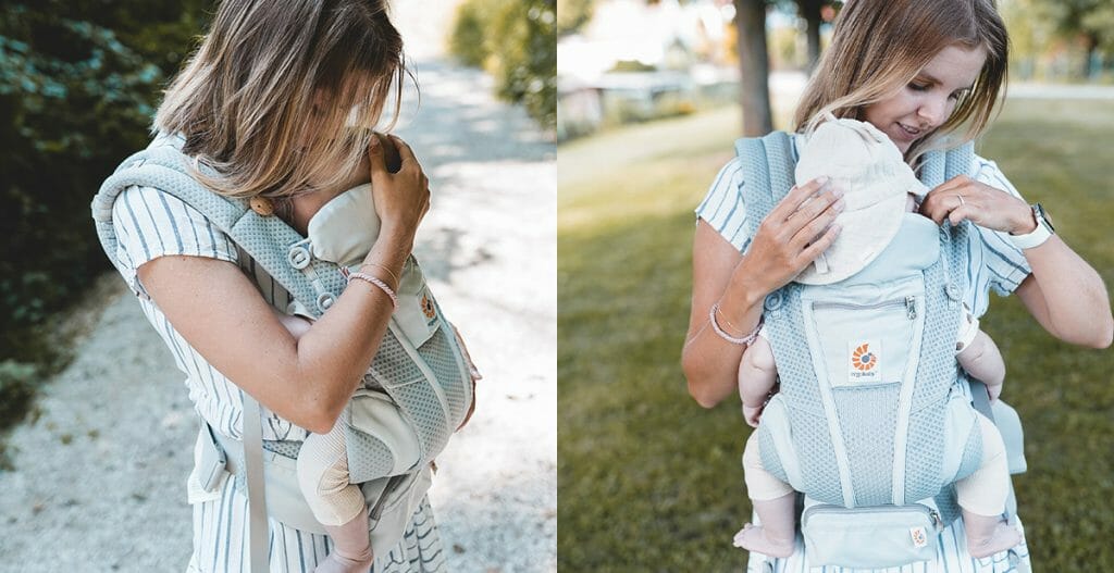 Mama trägt Baby in der Babytrage